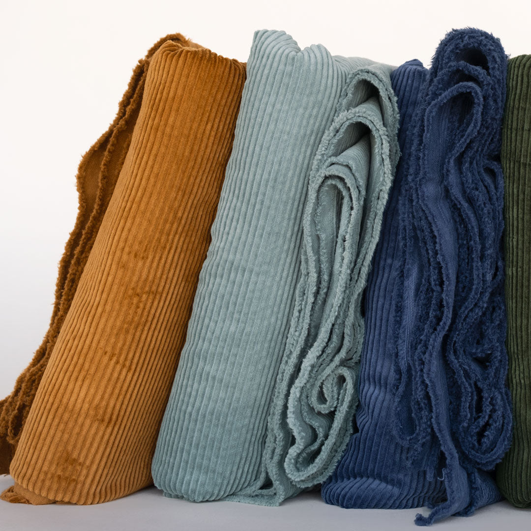 Natural cotton fiber corduroy with wide wales in Caramel brown, Pale Turquoise blue and Navy