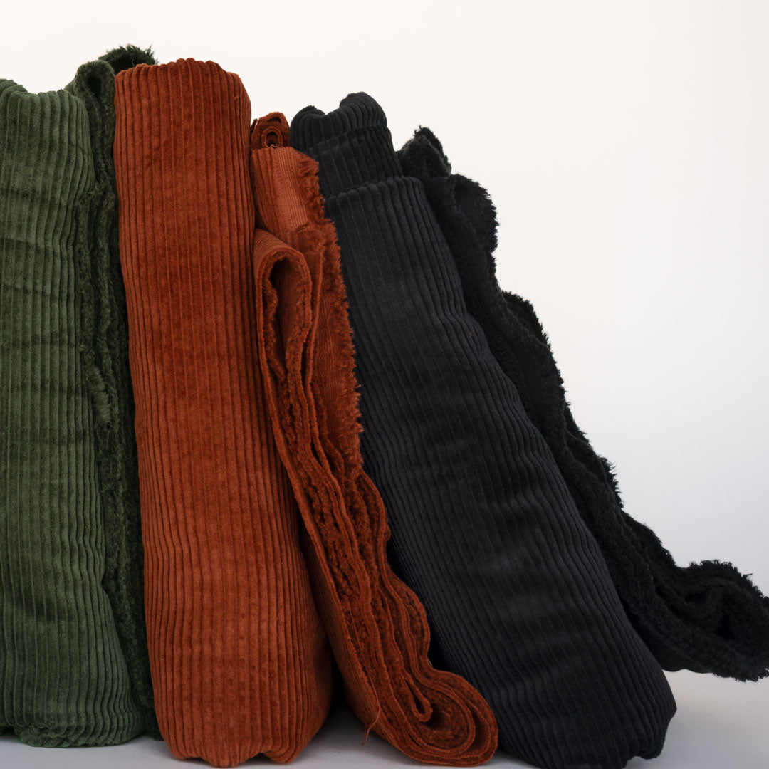 Natural cotton fiber wale corduroy in Jasper green, Spice red and Black