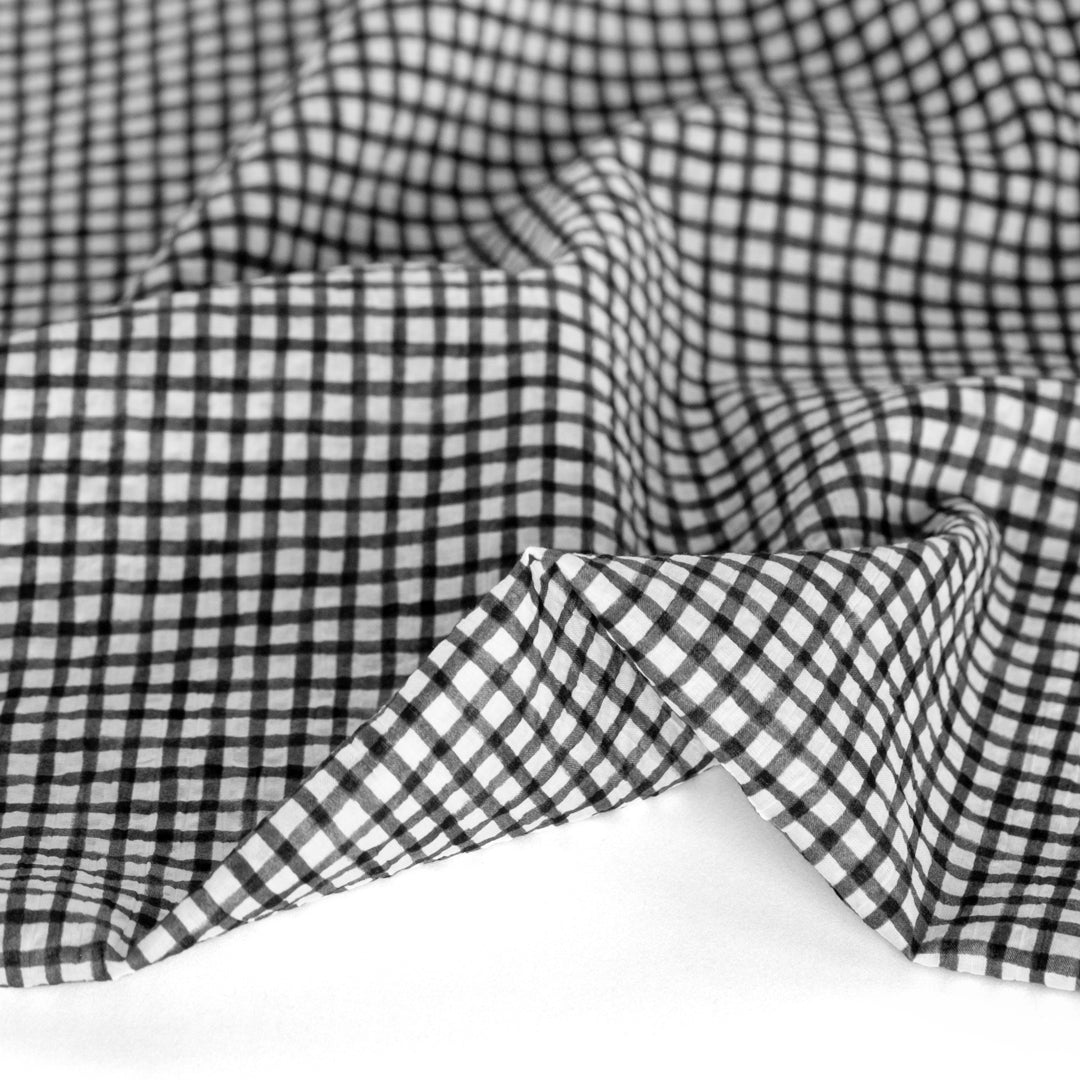 Natural fiber crinkled seersucker cotton in black white check grid print
