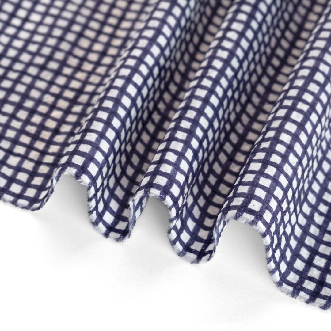Natural fiber crinkled seersucker cotton in navy and white check grid print