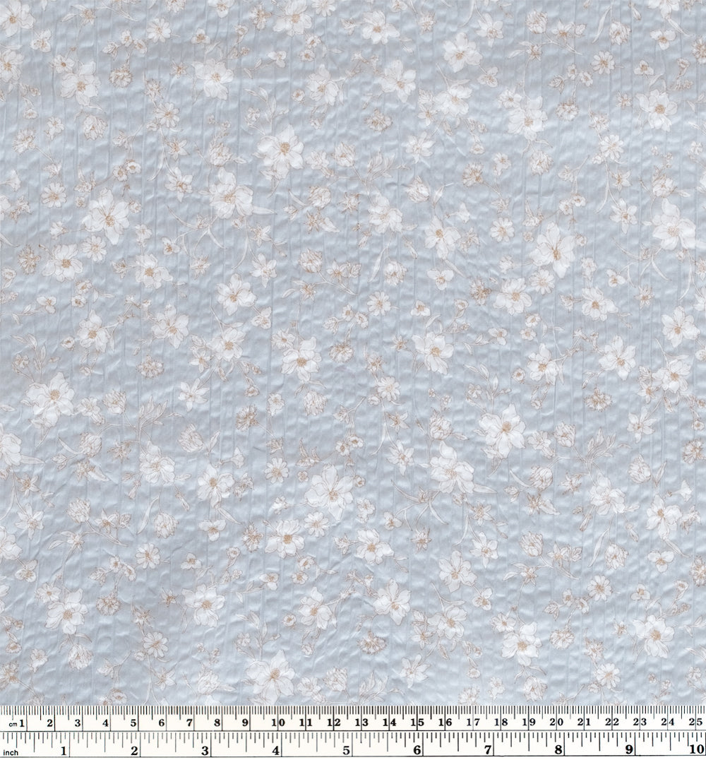 Natural fiber crinkled seersucker cotton in pale blue and ivory Wildflower print