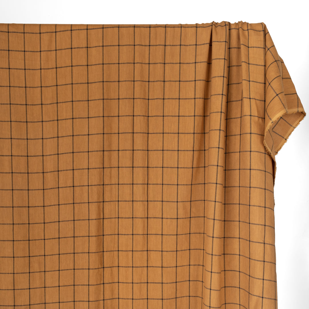 Lyocell and linen blend woven fabric in Caramel brown with black windowpane check yarn dyed design